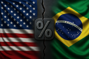Bandeiras dos EUA e do Brasil separadas por rachadura com símbolo de porcentagem. Imagem gerada por IA.