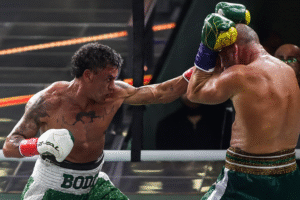 Perspectiva ilustrada e gerada por IA de Popó enfrentando Wanderlei Silva em um ringue de boxe.