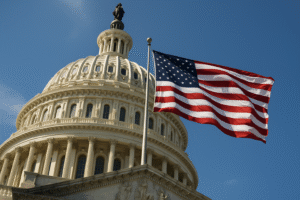 Vista inferior da cúpula do Capitólio dos Estados Unidos com a bandeira norte-americana tremulando ao vento em um dia ensolarado, em imagem gerada por inteligência artificial para fins jornalísticos.