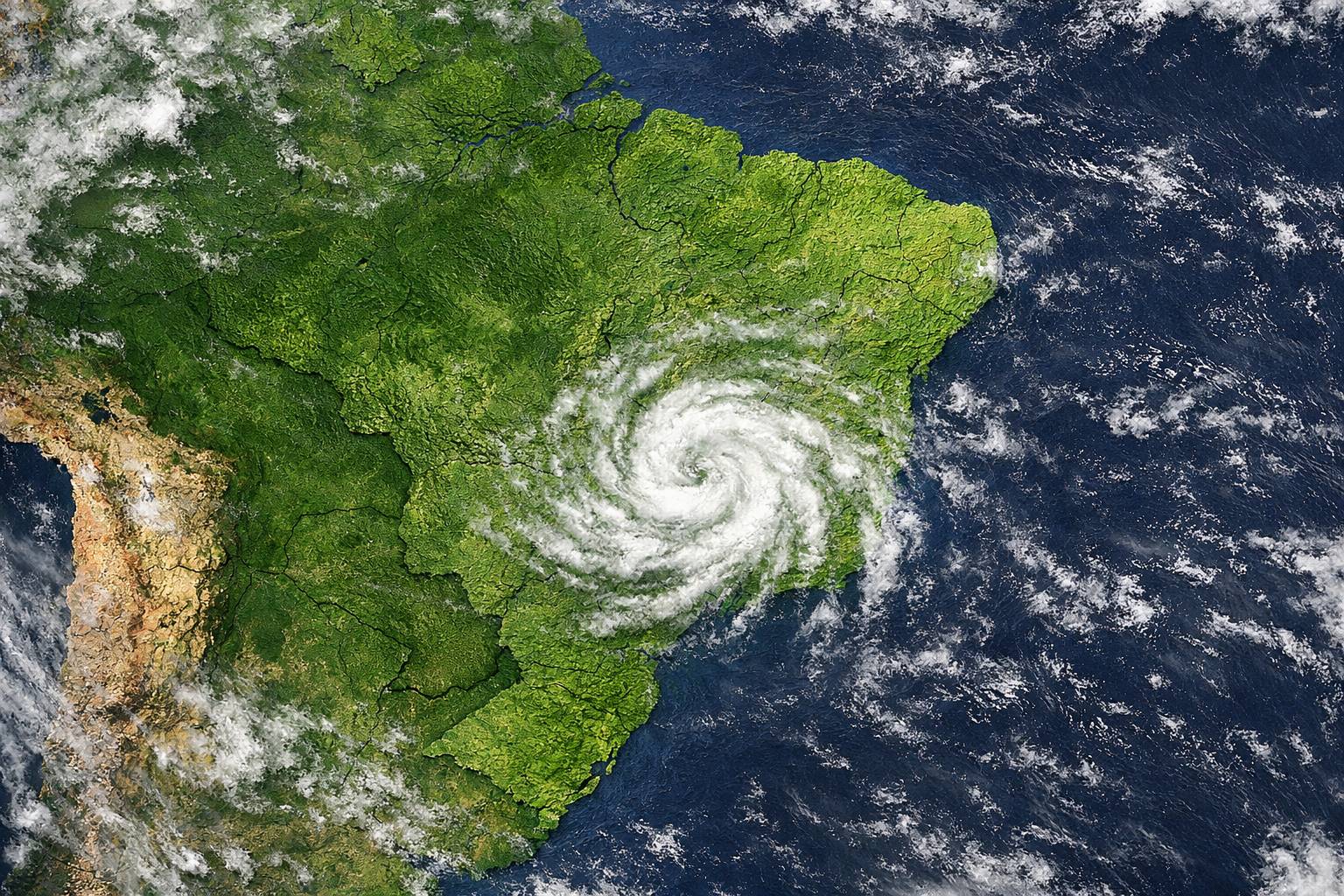 Imagem de satélite da América do Sul com destaque para o Brasil e formação simbólica de um ciclone fraco entre as regiões Sudeste e Centro-Oeste.