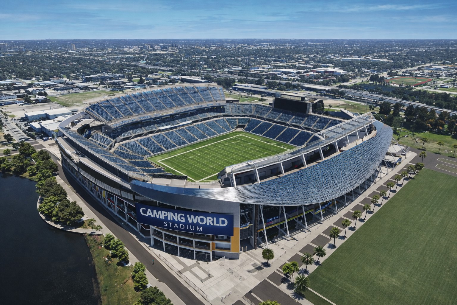 Ilustração fotográfica gerada por IA representando o Camping World Stadium, em Orlando, com vista semiaérea diurna.