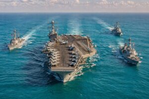 Ilustração de porta-aviões com navios de guerra dos EUA em alto mar.